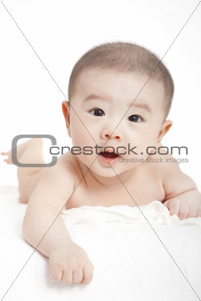 asian Baby boy  lying and looking at camrea