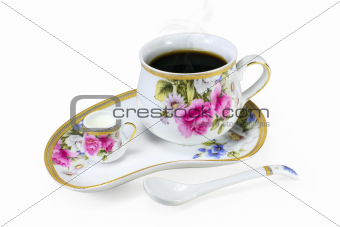 Set of cups of steaming coffee or tea and cream isolated on white