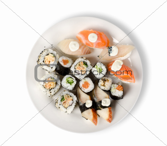 Sushi and rolls in a plate isolated