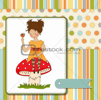 pretty young girl sitting on a mushroom and talking to a little bird