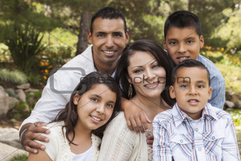 Happy Attractive Hispanic Family Portrait Outdoors In the Park.