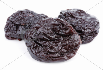 Dried plum fruits - prunes on white