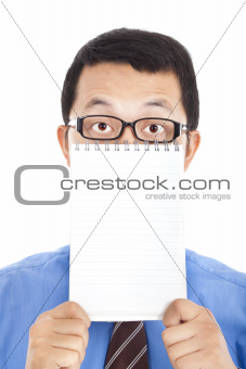 surprised businessman holding blank notebook