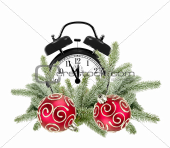 Green Christmas tree, decorative red balls and alarm clock isola