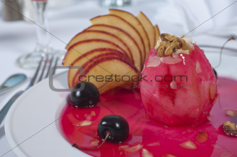 Baked apple dessert in cherry sauce