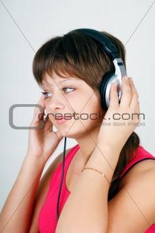teenage girl listening to music on headphones