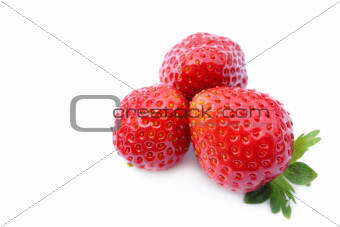 three fresh strawberries on white 