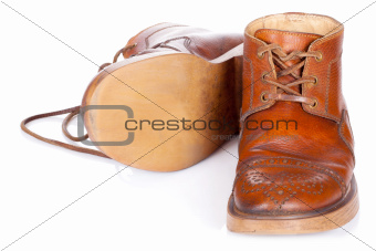Red old leather boots isolated on white background