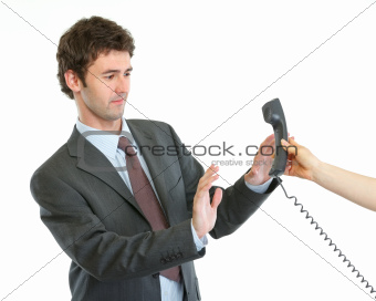Concerned businessman refusing answer phone call