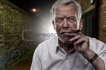 Senior man smoking a cigar
