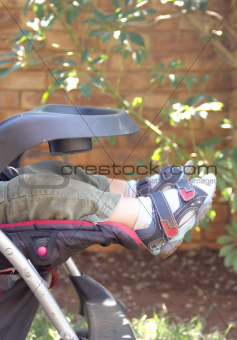 Feet of baby sleeping in a stroller