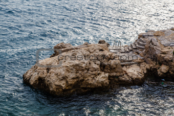 Rock and the Stairs Leading to the Sea in Rovinj, Croatia
