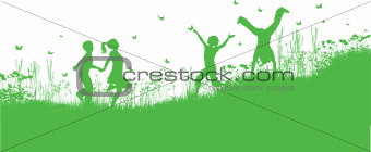 Children playing in grass and flowers