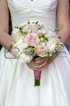 bride holding a bouquet of wedding flowers