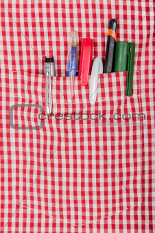 checkered shirt and pens