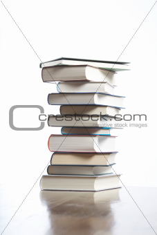 books piled on table 