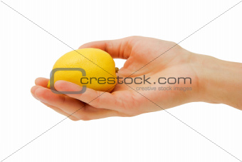 man's hand holding a lemon