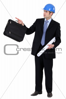 Engineer holding a briefcase and blueprint