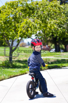 toddler on a balance bike