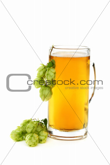Glass with beer and hop cones.