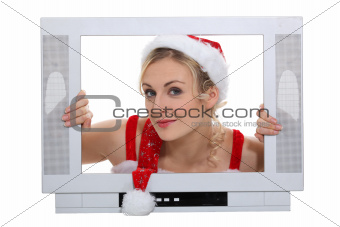 Lady Santa inside a television set