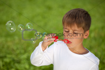 Little boy having fun with bubbles