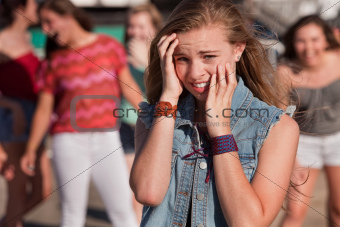 Teenagers Laughing at Scared Girl