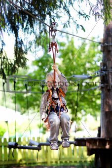 little boy ziplining