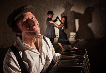 Smiling Accordion Player with Dancers