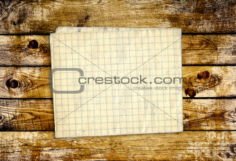 Sheet paper on wooden planks