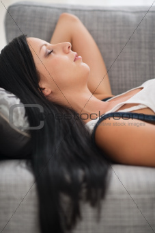 Young woman sleeping on sofa