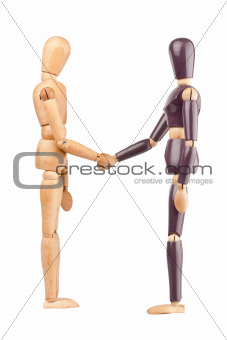 Wooden dummies shaking hands