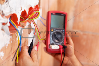 Electrician working - closeup on hands