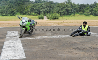 Superbike and rider on helipad