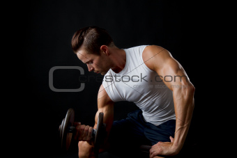 Male doing dumbbelll lifts