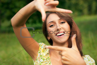 Smiling Woman Making Frame with Her Hands