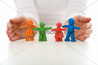Clay people family protected by woman hands