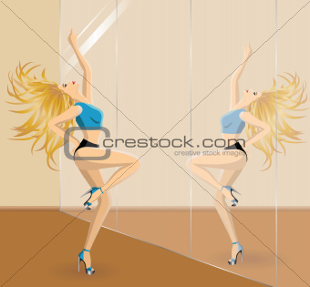 Beautiful blonde woman dancing  in front of the mirrow in gym