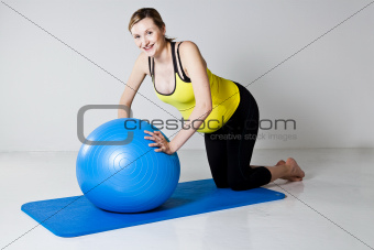 Pregnant woman doing push-up exercise