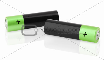 Closeup of two AA batteries on white