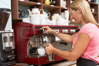 Woman Making Coffee In Caf