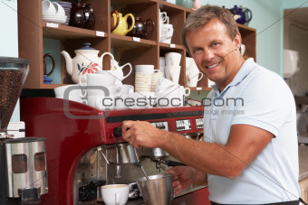 Man Making Coffee In Caf