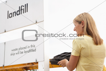 Woman At Recycling Centre