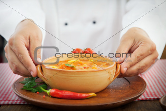 Chef with stew