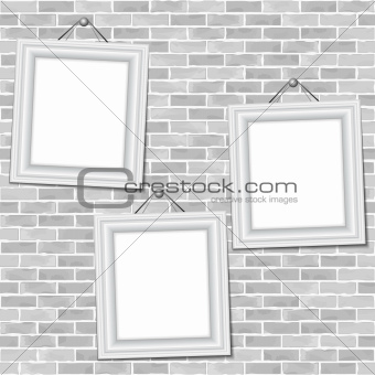 Frames on brick wall