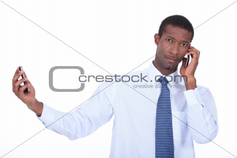 Man passing two phone calls