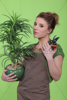 young woman holding a flowerpot