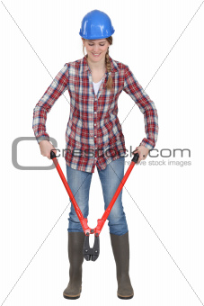 Woman using pair of bolt-cutters