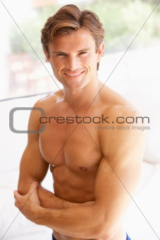 Portrait Of Bare Muscular Torso Of Young Man