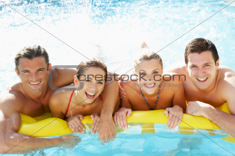 Group of Young friends having fun in pool